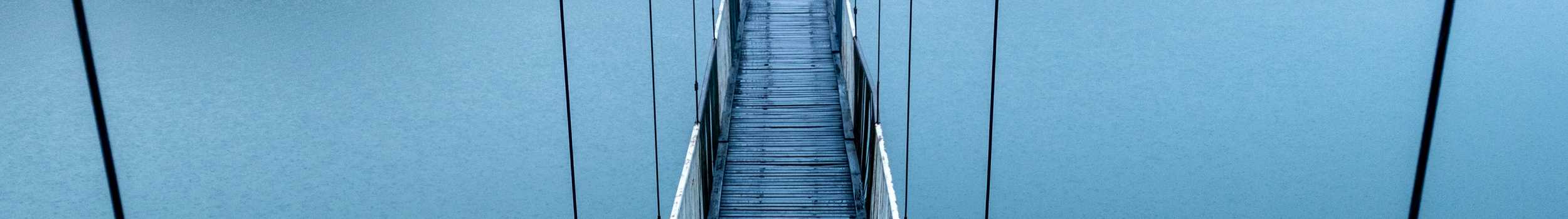 A photo of a bridge at sunset